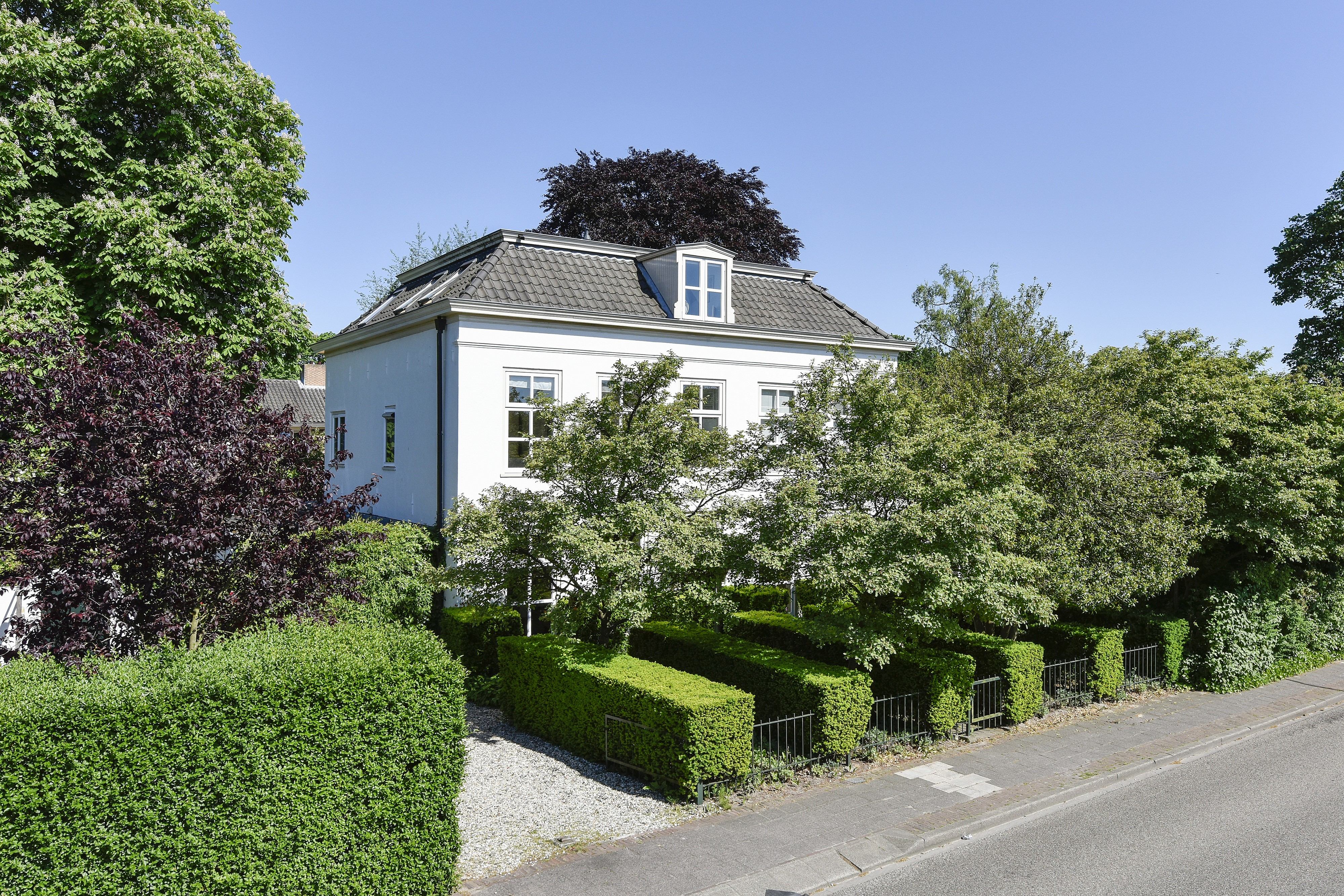 Beautiful traditional Dutch house with mature garden and sculptural hedges
